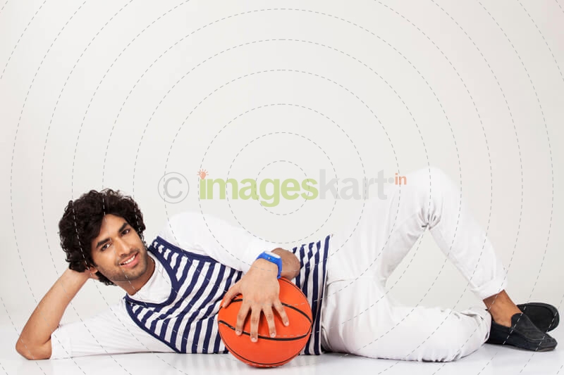 guy lying down with basketball