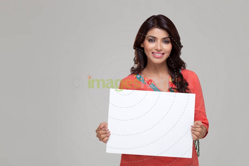 girl displaying blank white board