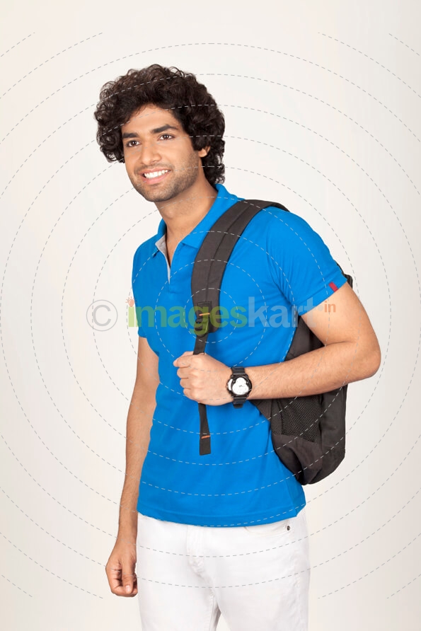 college boy carrying backpack