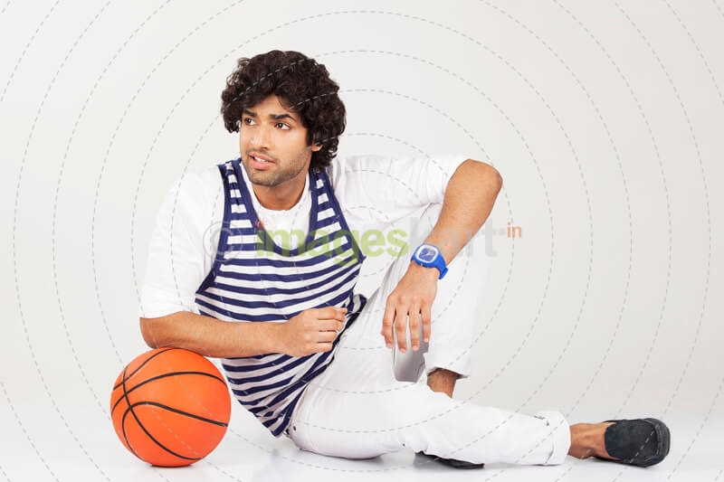 college boy posing with basketball