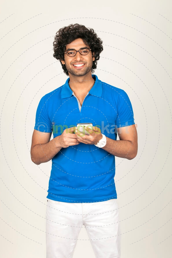 college boy texting while posing 