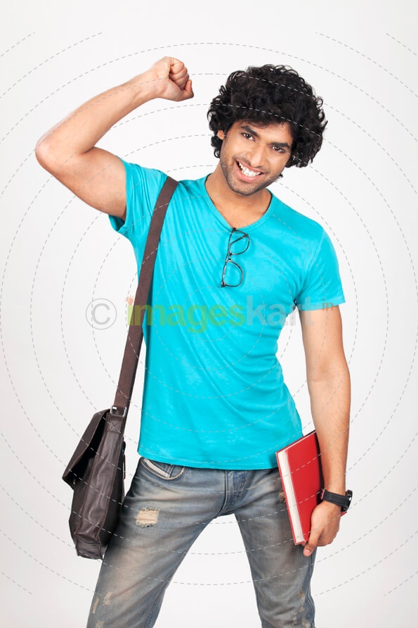 college boy carrying bag and holding a book