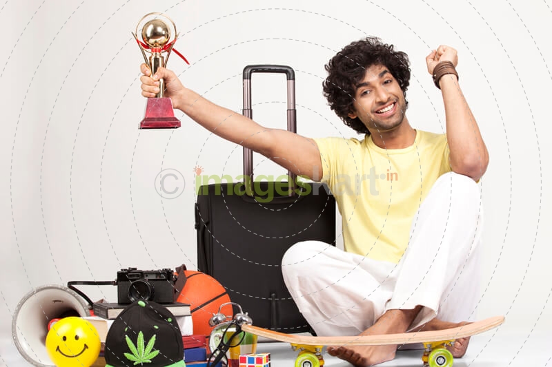 boy holding a trophy in excitement 