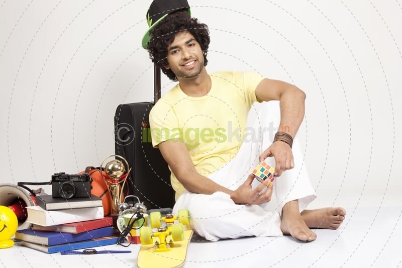 boy holding cube while posing