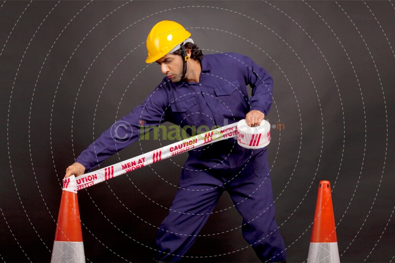 man with caution tape 