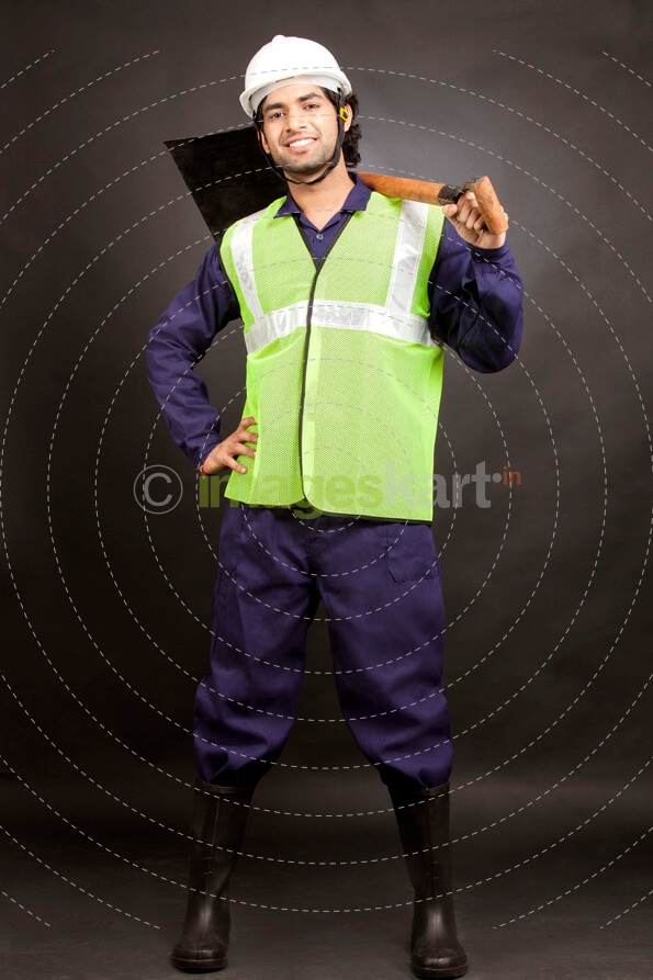 man posing with shovel