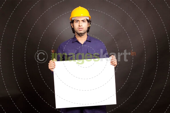 Technician miner engineer holding placard