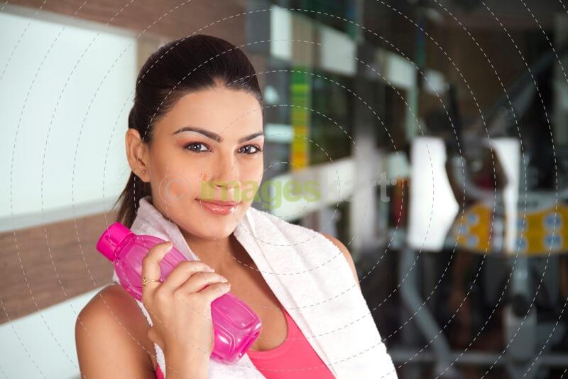 attractive girl holding a pink coloured water bottle