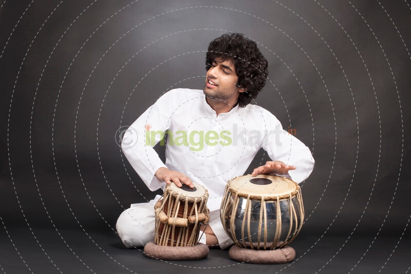 man performing with tabla