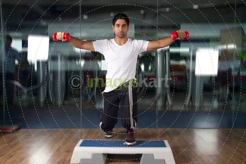 man exercising in gym 