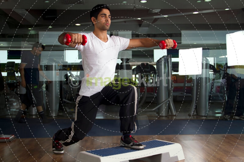 man performing aerobics at the gym