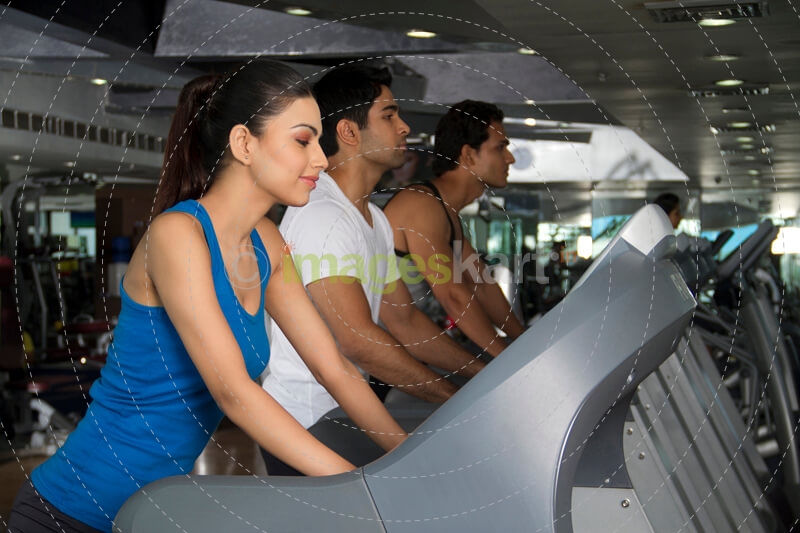 shot of three young people in the treadmill