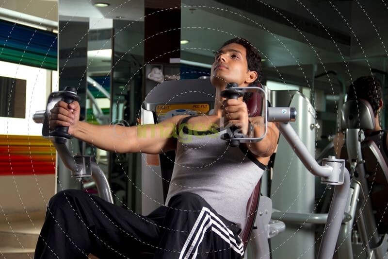 lean boy doing intense workout