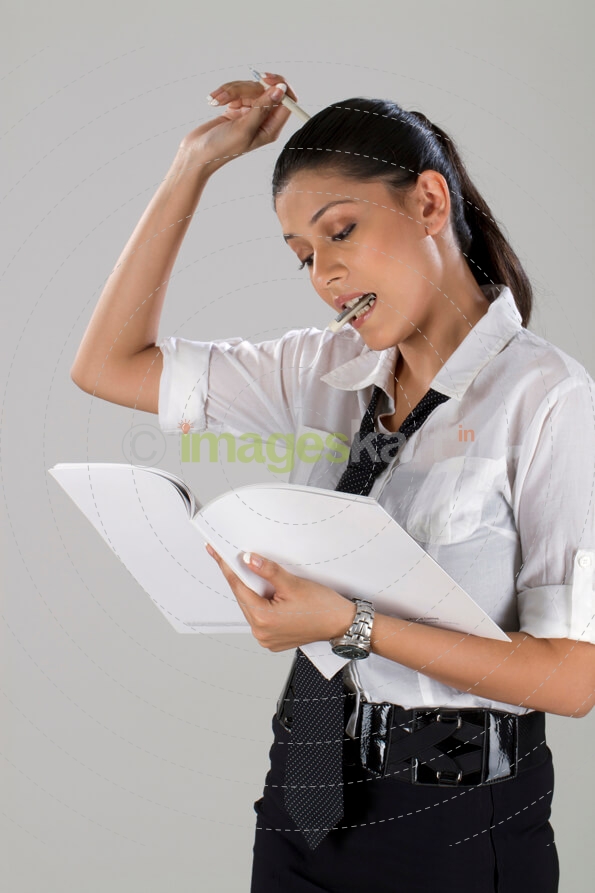 business woman with file and pen in hand