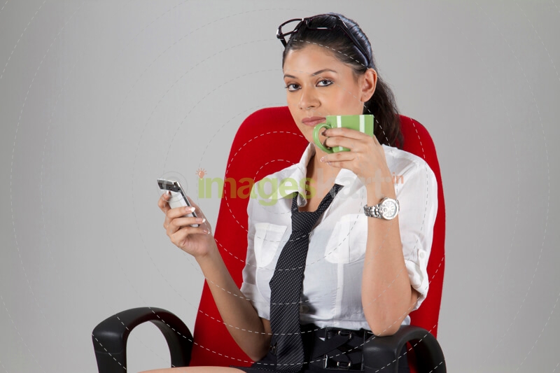 girl sitting on chair and having coffee