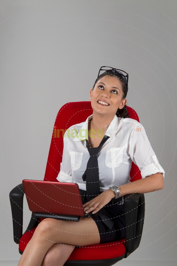 working woman thinking while working