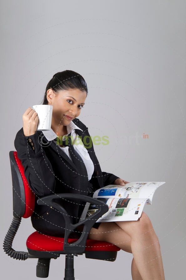 corporate woman reading a magazine