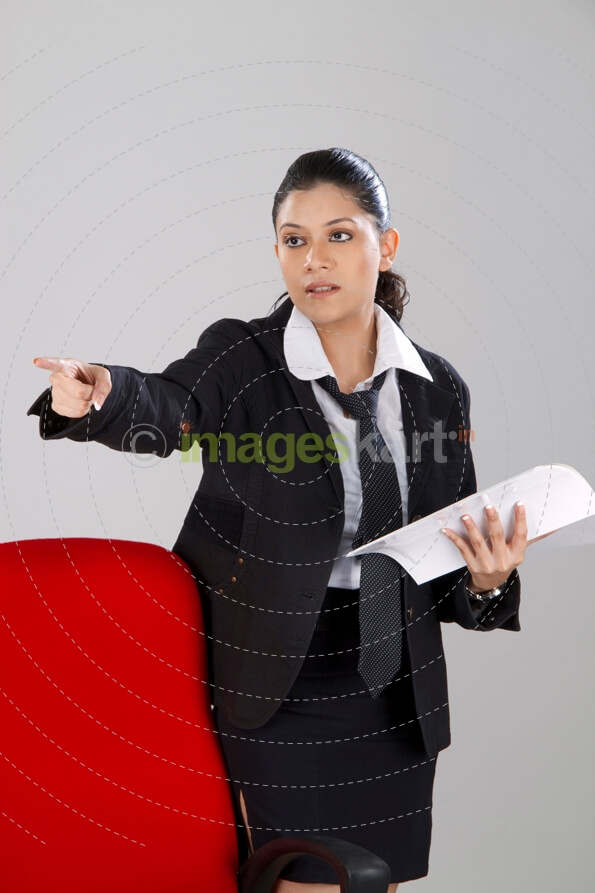 business woman pointing towards you