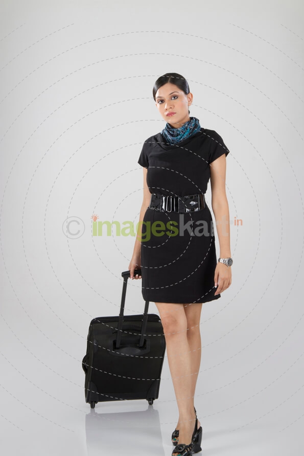 woman posing with her suitcase