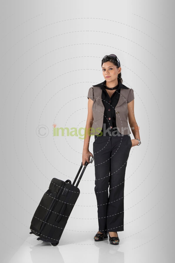 woman posing with a suitcase