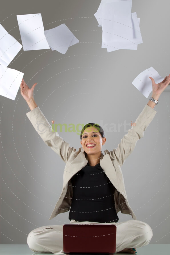 woman throwing papers