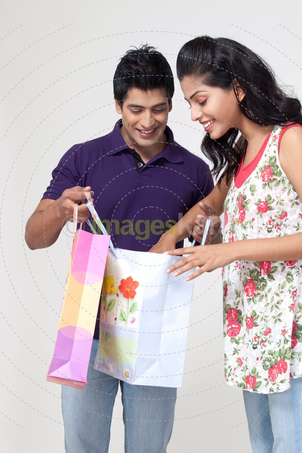 couple looking at shopping their bags