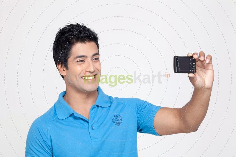 boy smiling while taking selfie 