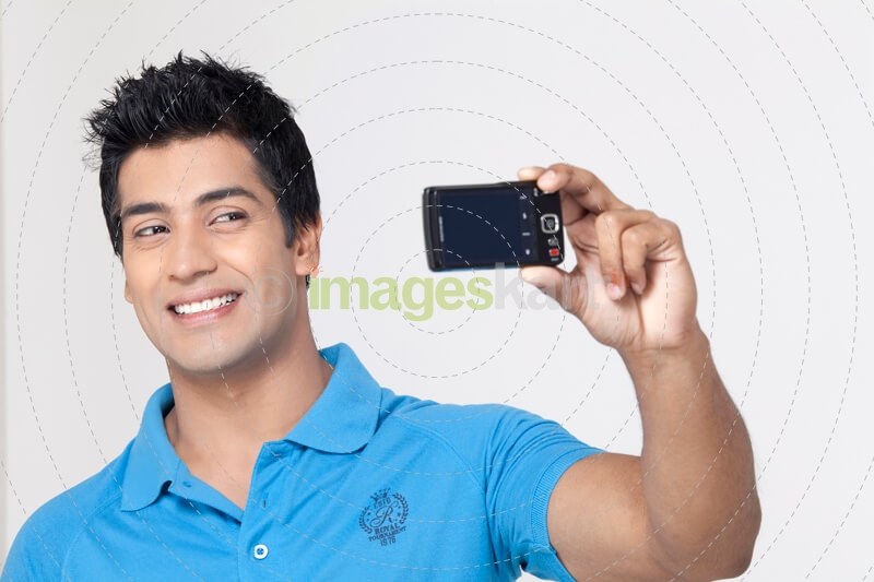 boy taking selfie