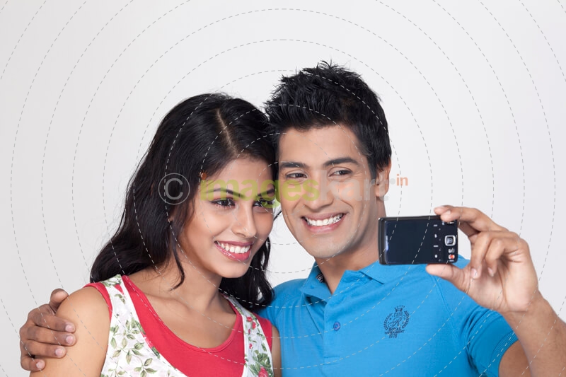 close up of couple taking their picture 