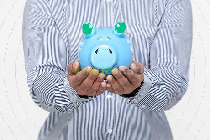 man holding piggy bank against a white background