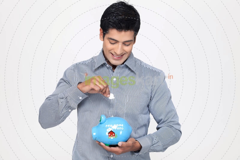 portrait of man with piggy bank