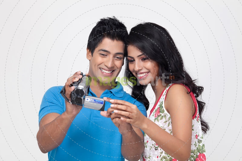 couple recording with video camera 