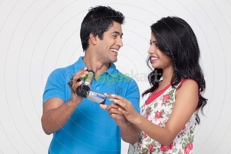 couple with a video camera