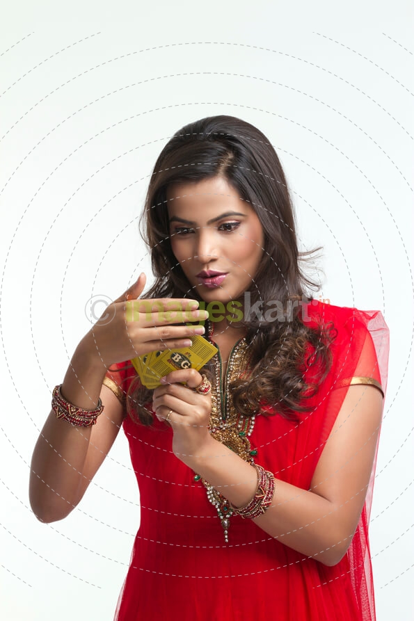 woman hiding playing cards