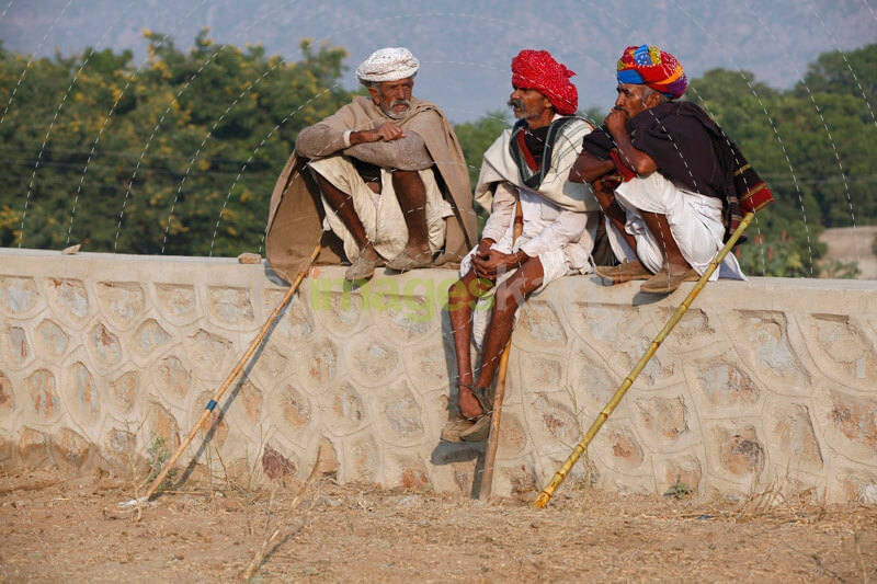old men sitting and talking