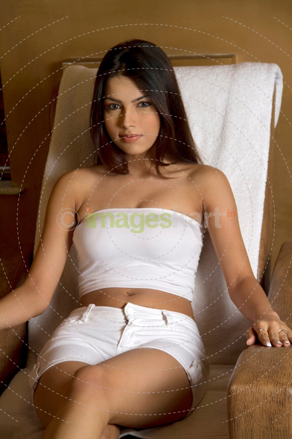 portrait of a sensuous young female sitting on a chair