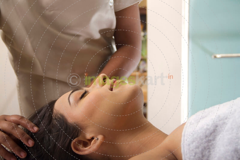 girl taking head massage