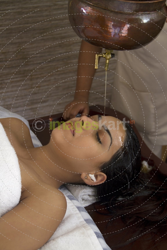 woman having ayurvedic spa treatment 