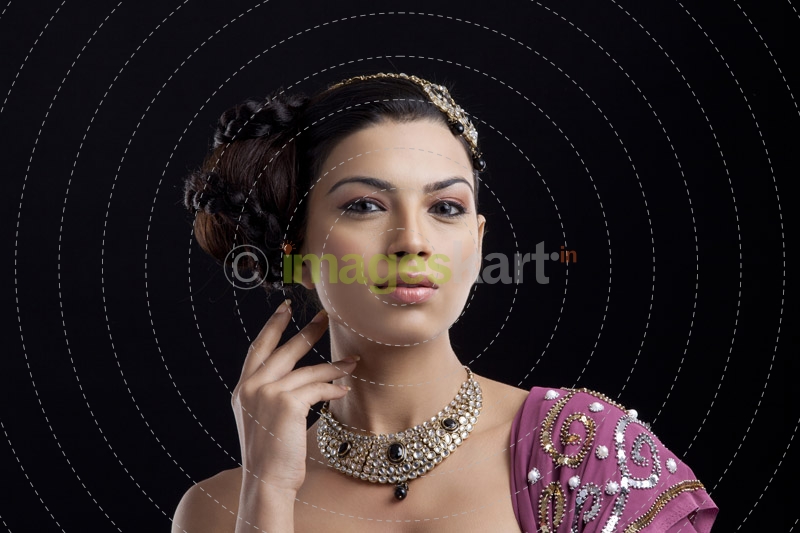 traditionally dressed woman looking into the camera