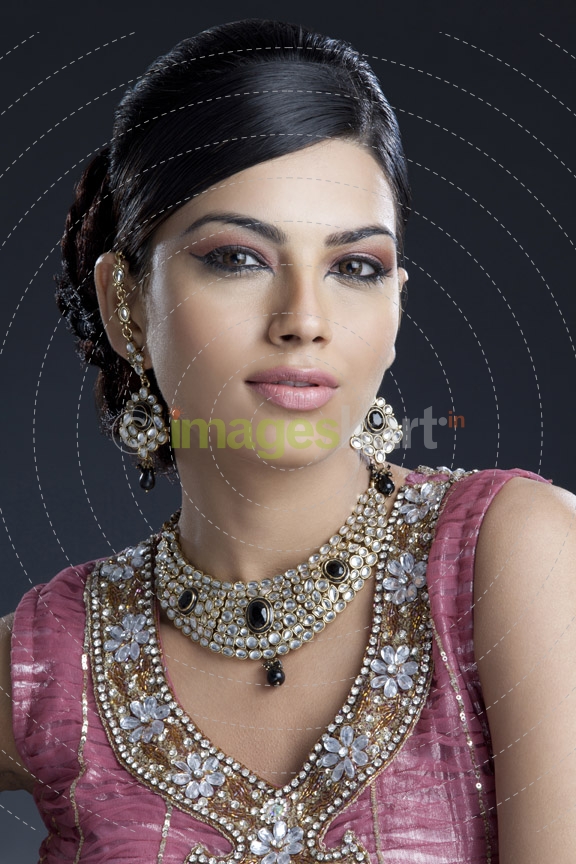 woman looking at camera and posing wearing jewellery