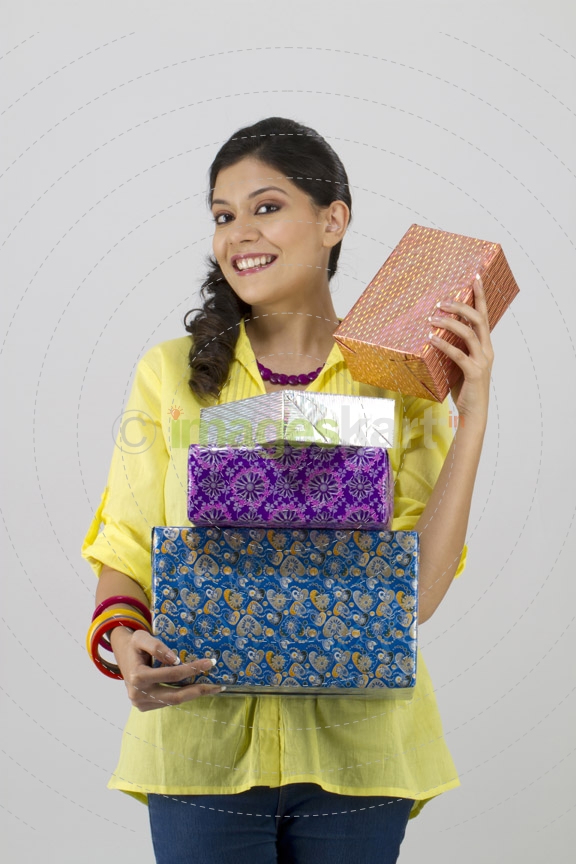 girl with gifts smiling 