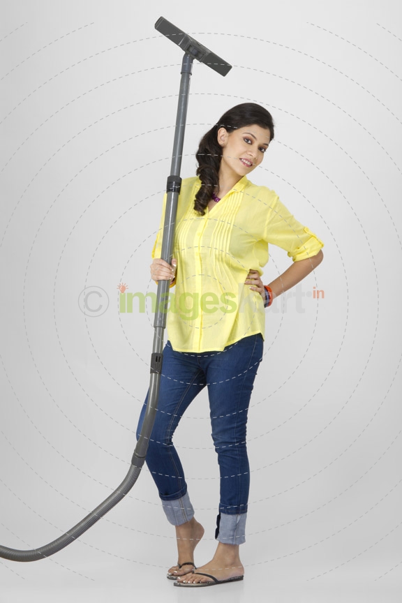 woman posing with vacuum cleaner 