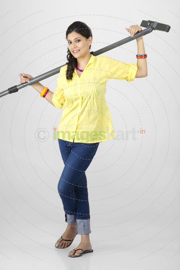 woman posing with vacuum cleaner 