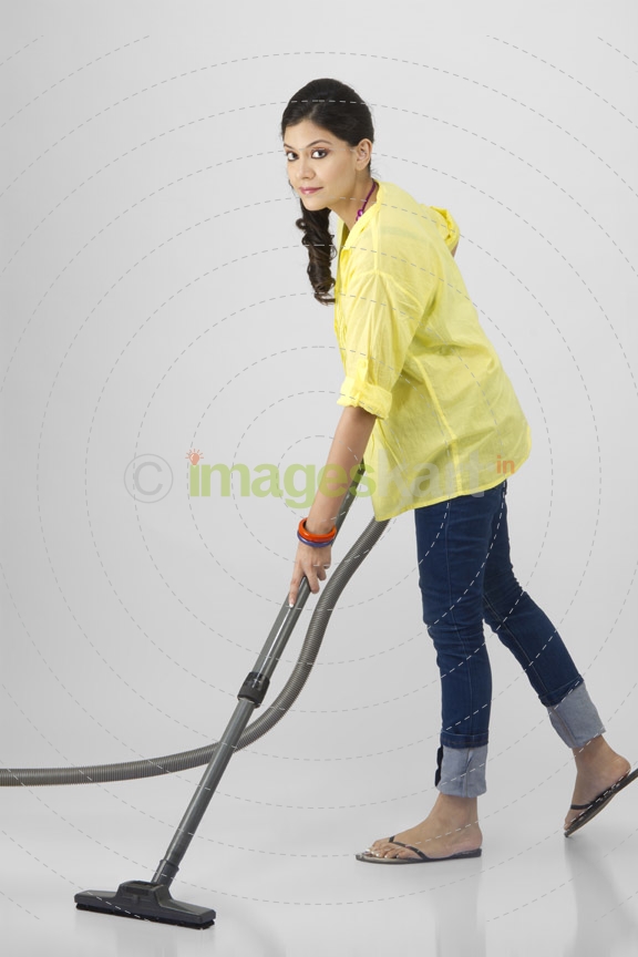 woman cleaning with vacuum cleaner 