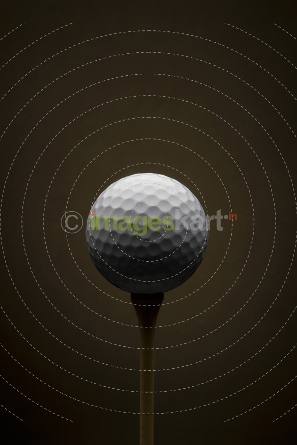 Golf ball with dark brown background