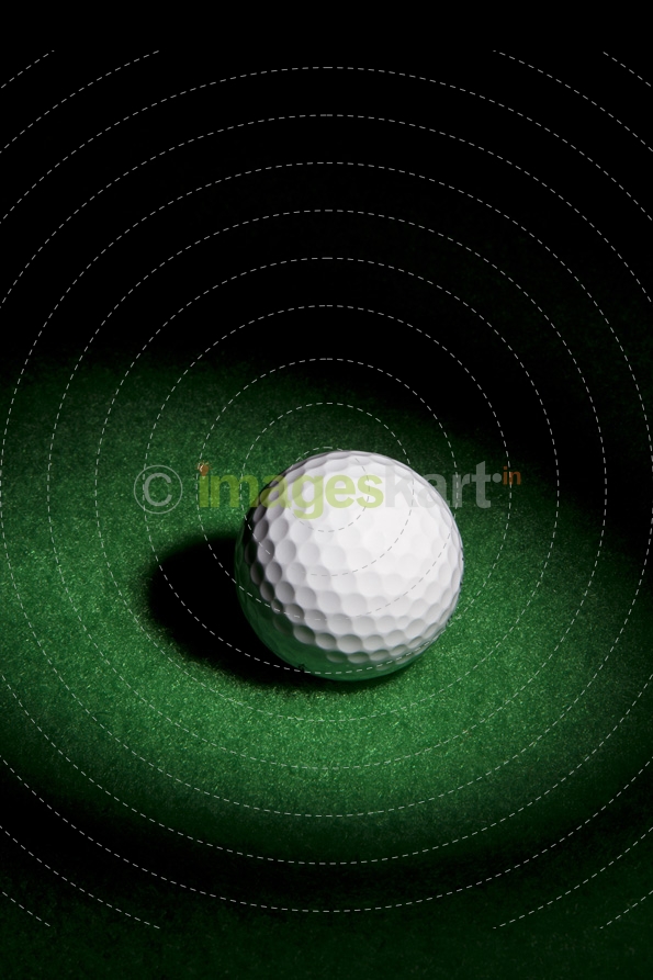 a golf ball on a green surface
