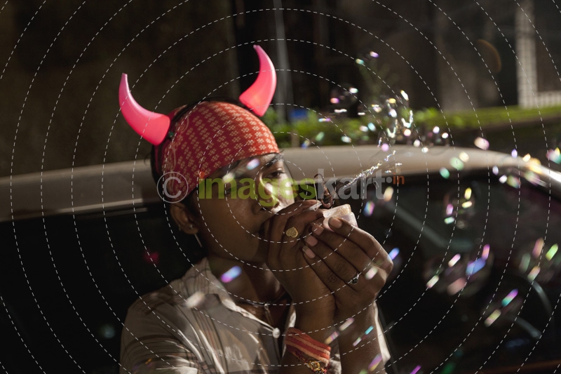 boy blowing bubbles at local fairs 