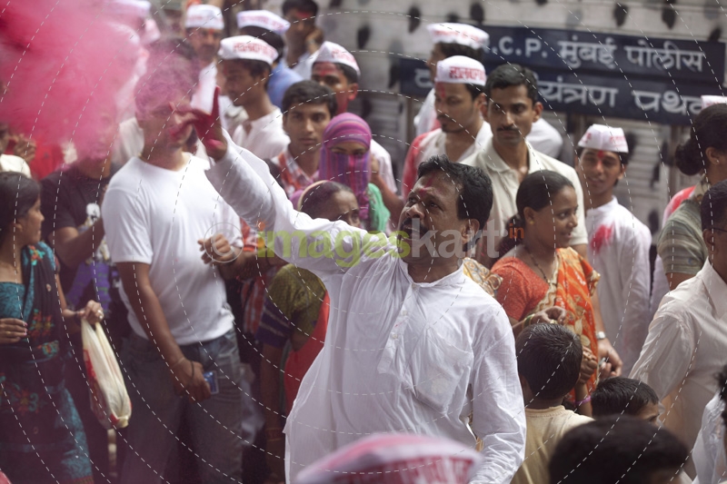 people playing with colours during ganesh visarjan festival 
