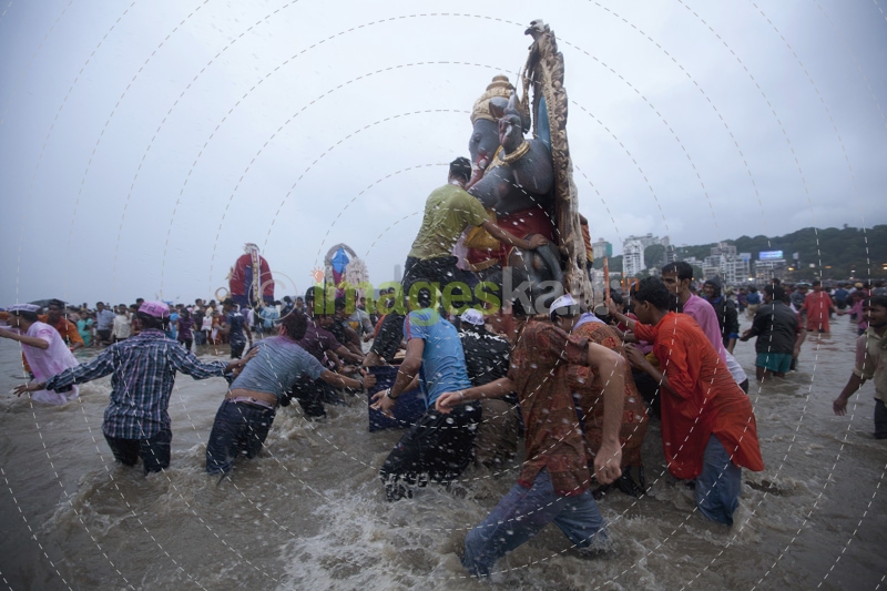 indian celebrating ganesh visarjan 