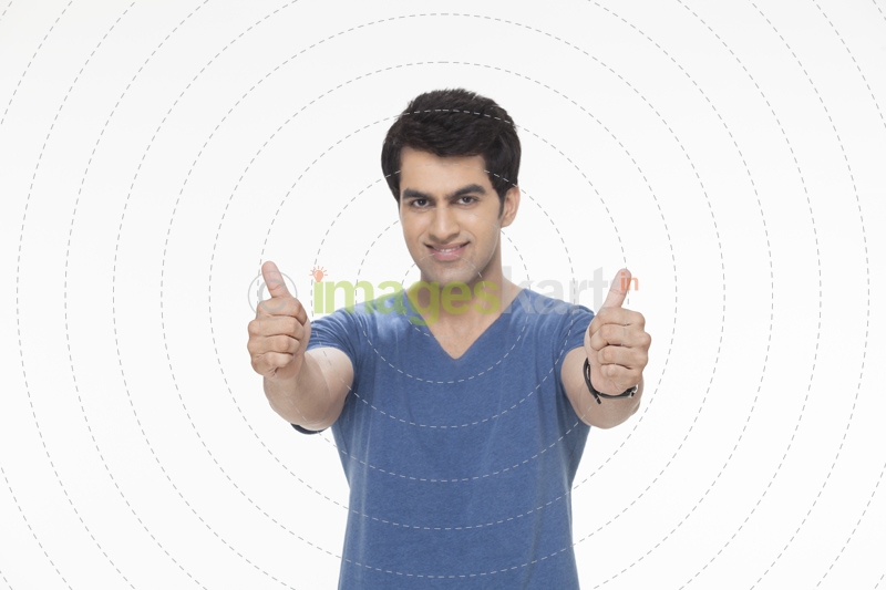 man doing thumbs up with both the hands